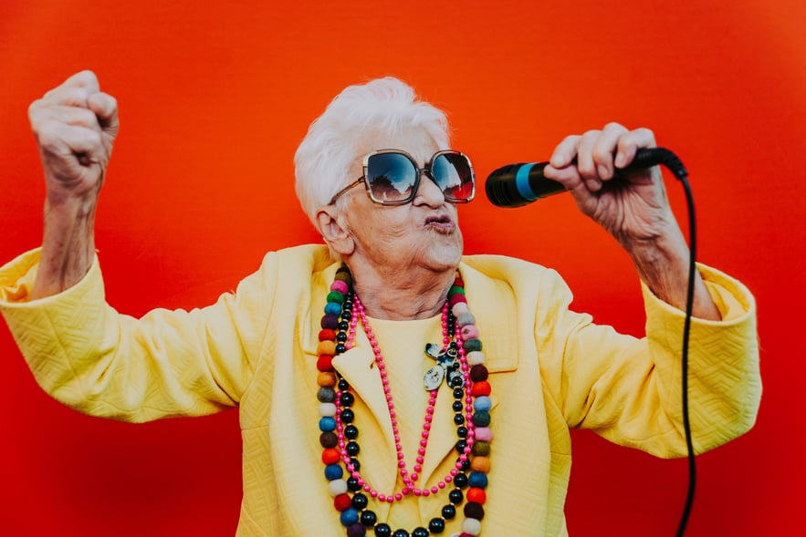 Senior Woman Dressed in Fancy Clothes and Singing 